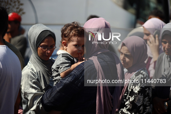 A group of Palestinian children and patients are awaiting in Deir Al-Balah, central Gaza Strip, on July 28, 2024, for their medical evacuati...