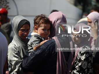 A group of Palestinian children and patients are awaiting in Deir Al-Balah, central Gaza Strip, on July 28, 2024, for their medical evacuati...