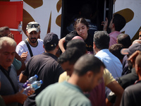 A group of Palestinian children and patients are awaiting in Deir Al-Balah, central Gaza Strip, on July 28, 2024, for their medical evacuati...