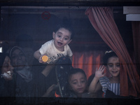 A group of Palestinian children and patients are awaiting in Deir Al-Balah, central Gaza Strip, on July 28, 2024, for their medical evacuati...