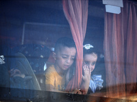 A group of Palestinian children and patients are awaiting in Deir Al-Balah, central Gaza Strip, on July 28, 2024, for their medical evacuati...