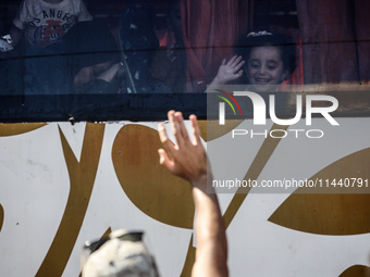 A group of Palestinian children and patients are awaiting in Deir Al-Balah, central Gaza Strip, on July 28, 2024, for their medical evacuati...