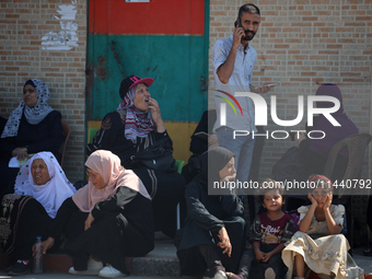 A group of Palestinian children and patients are awaiting in Deir Al-Balah, central Gaza Strip, on July 28, 2024, for their medical evacuati...