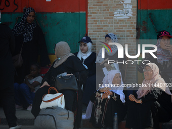 A group of Palestinian children and patients are awaiting in Deir Al-Balah, central Gaza Strip, on July 28, 2024, for their medical evacuati...