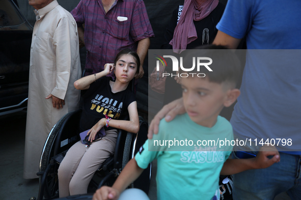 A group of Palestinian children and patients are awaiting in Deir Al-Balah, central Gaza Strip, on July 28, 2024, for their medical evacuati...