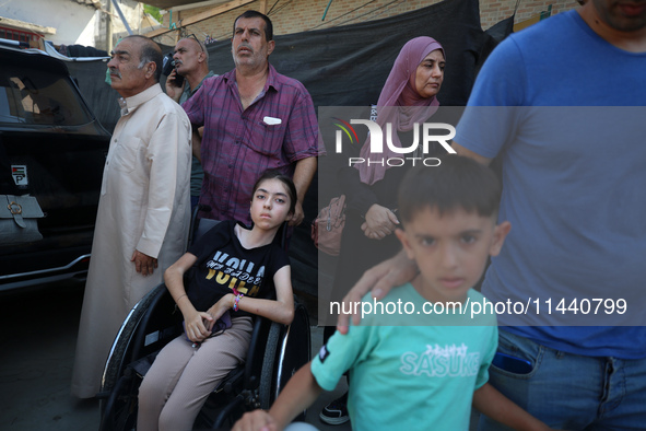 A group of Palestinian children and patients are awaiting in Deir Al-Balah, central Gaza Strip, on July 28, 2024, for their medical evacuati...