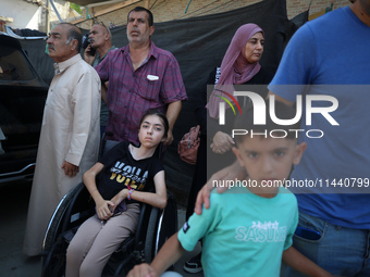 A group of Palestinian children and patients are awaiting in Deir Al-Balah, central Gaza Strip, on July 28, 2024, for their medical evacuati...