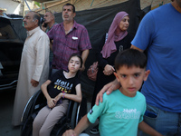 A group of Palestinian children and patients are awaiting in Deir Al-Balah, central Gaza Strip, on July 28, 2024, for their medical evacuati...