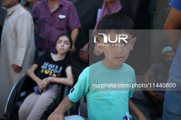 A group of Palestinian children and patients are awaiting in Deir Al-Balah, central Gaza Strip, on July 28, 2024, for their medical evacuati...