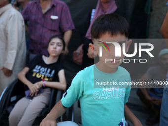 A group of Palestinian children and patients are awaiting in Deir Al-Balah, central Gaza Strip, on July 28, 2024, for their medical evacuati...