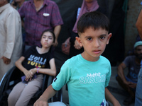 A group of Palestinian children and patients are awaiting in Deir Al-Balah, central Gaza Strip, on July 28, 2024, for their medical evacuati...