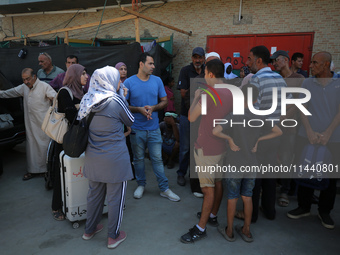 A group of Palestinian children and patients are awaiting in Deir Al-Balah, central Gaza Strip, on July 28, 2024, for their medical evacuati...