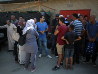 A group of Palestinian children and patients are awaiting in Deir Al-Balah, central Gaza Strip, on July 28, 2024, for their medical evacuati...