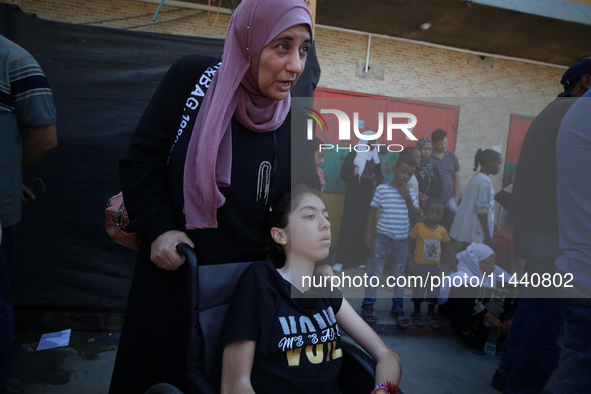 A group of Palestinian children and patients are awaiting in Deir Al-Balah, central Gaza Strip, on July 28, 2024, for their medical evacuati...