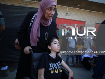 A group of Palestinian children and patients are awaiting in Deir Al-Balah, central Gaza Strip, on July 28, 2024, for their medical evacuati...