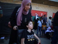 A group of Palestinian children and patients are awaiting in Deir Al-Balah, central Gaza Strip, on July 28, 2024, for their medical evacuati...