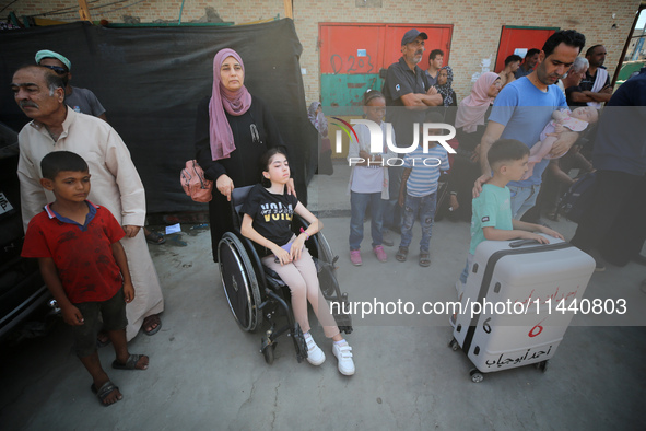 A group of Palestinian children and patients are awaiting in Deir Al-Balah, central Gaza Strip, on July 28, 2024, for their medical evacuati...