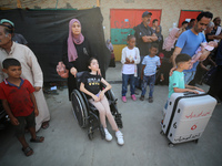 A group of Palestinian children and patients are awaiting in Deir Al-Balah, central Gaza Strip, on July 28, 2024, for their medical evacuati...