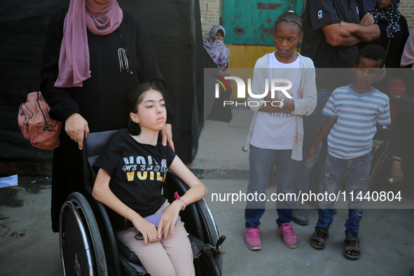 A group of Palestinian children and patients are awaiting in Deir Al-Balah, central Gaza Strip, on July 28, 2024, for their medical evacuati...