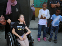 A group of Palestinian children and patients are awaiting in Deir Al-Balah, central Gaza Strip, on July 28, 2024, for their medical evacuati...