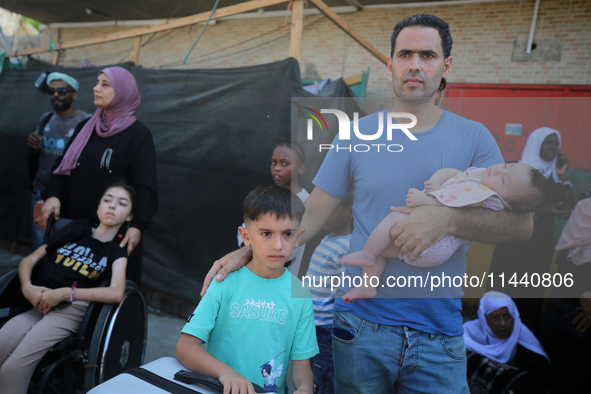 A group of Palestinian children and patients are awaiting in Deir Al-Balah, central Gaza Strip, on July 28, 2024, for their medical evacuati...