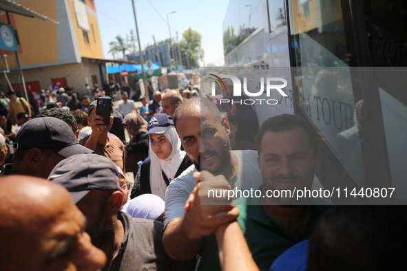 A group of Palestinian children and patients are awaiting in Deir Al-Balah, central Gaza Strip, on July 28, 2024, for their medical evacuati...