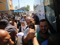 A group of Palestinian children and patients are awaiting in Deir Al-Balah, central Gaza Strip, on July 28, 2024, for their medical evacuati...