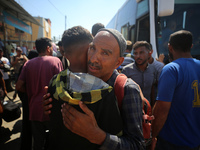 A group of Palestinian children and patients are awaiting in Deir Al-Balah, central Gaza Strip, on July 28, 2024, for their medical evacuati...