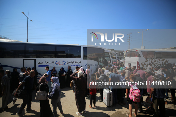 A group of Palestinian children and patients are awaiting in Deir Al-Balah, central Gaza Strip, on July 28, 2024, for their medical evacuati...