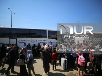 A group of Palestinian children and patients are awaiting in Deir Al-Balah, central Gaza Strip, on July 28, 2024, for their medical evacuati...