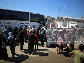 A group of Palestinian children and patients are awaiting in Deir Al-Balah, central Gaza Strip, on July 28, 2024, for their medical evacuati...