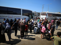 A group of Palestinian children and patients are awaiting in Deir Al-Balah, central Gaza Strip, on July 28, 2024, for their medical evacuati...