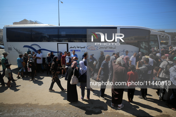 A group of Palestinian children and patients are awaiting in Deir Al-Balah, central Gaza Strip, on July 28, 2024, for their medical evacuati...