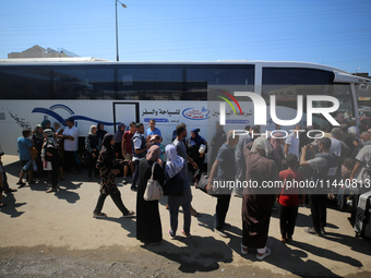 A group of Palestinian children and patients are awaiting in Deir Al-Balah, central Gaza Strip, on July 28, 2024, for their medical evacuati...