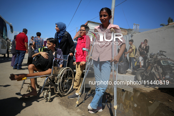 A group of Palestinian children and patients are awaiting in Deir Al-Balah, central Gaza Strip, on July 28, 2024, for their medical evacuati...