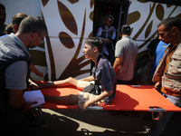 A group of Palestinian children and patients are awaiting in Deir Al-Balah, central Gaza Strip, on July 28, 2024, for their medical evacuati...