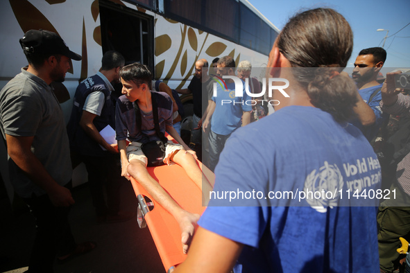 A group of Palestinian children and patients are awaiting in Deir Al-Balah, central Gaza Strip, on July 28, 2024, for their medical evacuati...