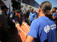 A group of Palestinian children and patients are awaiting in Deir Al-Balah, central Gaza Strip, on July 28, 2024, for their medical evacuati...