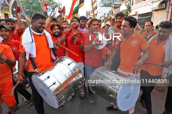 Kanwariyas are carrying holy water from the shrine 'Galta Peeth Tirtha' and going back to their pilgrimage in the auspicious month of 'Sharv...