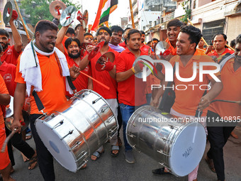 Kanwariyas are carrying holy water from the shrine 'Galta Peeth Tirtha' and going back to their pilgrimage in the auspicious month of 'Sharv...