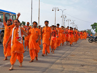 Kanwariyas are carrying holy water from the shrine 'Galta Peeth Tirtha' and going back to their pilgrimage in the auspicious month of 'Sharv...