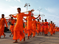 Kanwariyas are carrying holy water from the shrine 'Galta Peeth Tirtha' and going back to their pilgrimage in the auspicious month of 'Sharv...