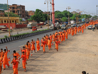 Kanwariyas are carrying holy water from the shrine 'Galta Peeth Tirtha' and going back to their pilgrimage in the auspicious month of 'Sharv...