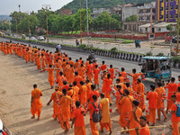 Kanwariyas are carrying holy water from the shrine 'Galta Peeth Tirtha' and going back to their pilgrimage in the auspicious month of 'Sharv...