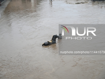 Bronze sculptures of horses and warriors are being seen submerged by floods at the Toudao wharf in Jilin City, Jilin province, China, on Jul...