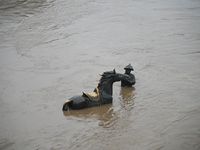 Bronze sculptures of horses and warriors are being seen submerged by floods at the Toudao wharf in Jilin City, Jilin province, China, on Jul...