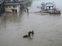 Bronze sculptures of horses and warriors are being seen submerged by floods at the Toudao wharf in Jilin City, Jilin province, China, on Jul...