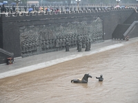 Bronze sculptures of horses and warriors are being seen submerged by floods at the Toudao wharf in Jilin City, Jilin province, China, on Jul...