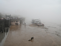 Bronze sculptures of horses and warriors are being seen submerged by floods at the Toudao wharf in Jilin City, Jilin province, China, on Jul...