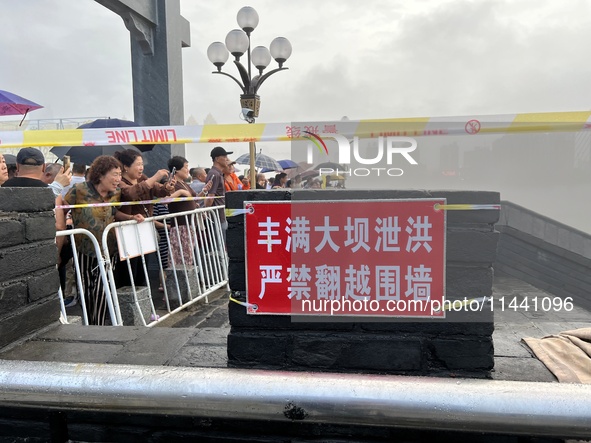 A protective fence is being installed at the first road pier at the Toudao wharf in Jilin City, Jilin province, China, on July 28, 2024. 